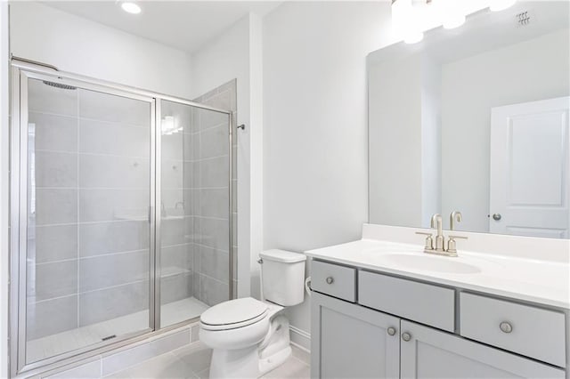 bathroom featuring walk in shower, tile patterned floors, vanity, and toilet