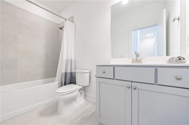 full bathroom featuring tile patterned flooring, vanity, toilet, and shower / tub combo with curtain