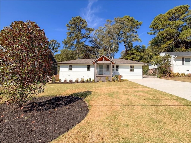 ranch-style home with a front yard