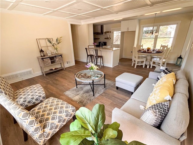 living room with coffered ceiling, sink, and hardwood / wood-style floors