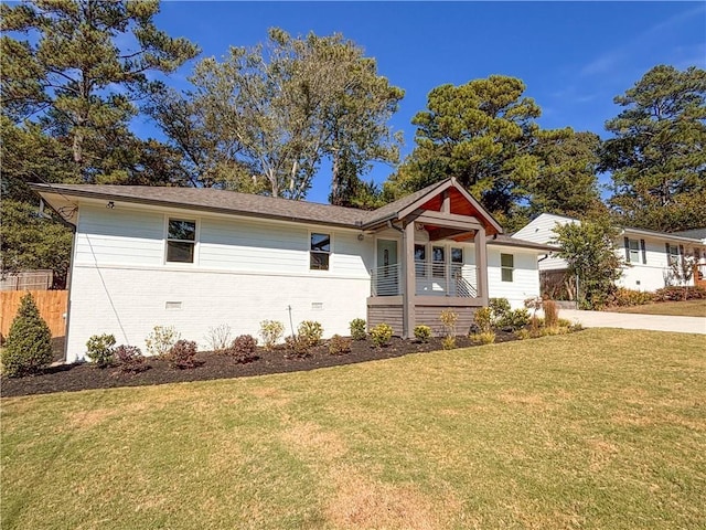 view of front of home with a front lawn and covered porch