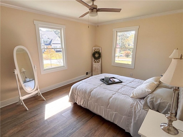 bedroom featuring crown molding, ceiling fan, and dark hardwood / wood-style floors