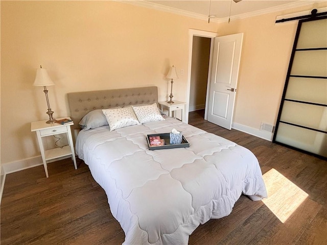 bedroom with crown molding and dark hardwood / wood-style floors