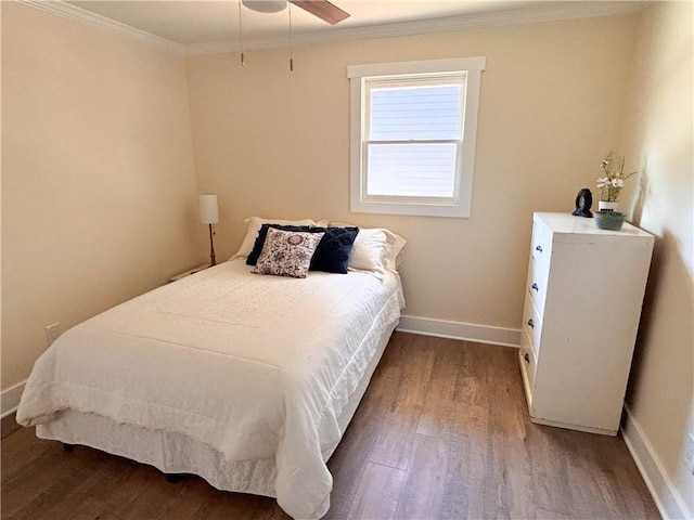 bedroom featuring ornamental molding, hardwood / wood-style floors, and ceiling fan