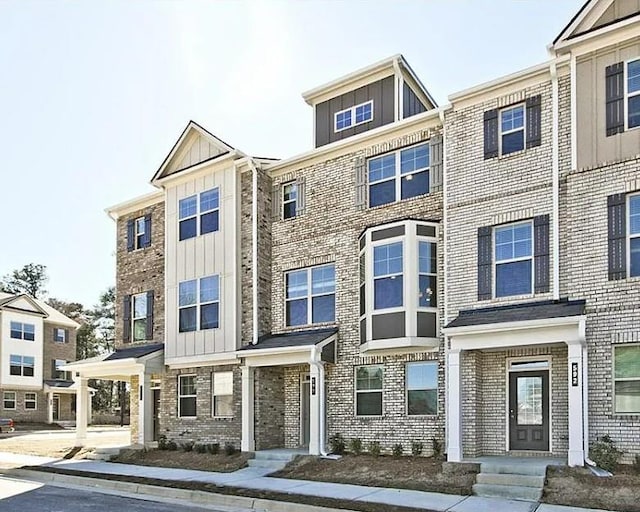 541 Fundao Ln, Lawrenceville, GA 30046 - townhome / multi-family property featuring board and batten siding