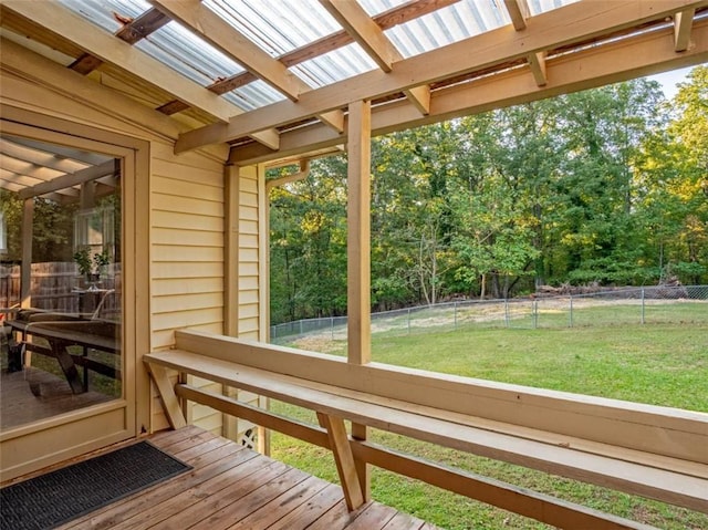 wooden deck with fence and a lawn