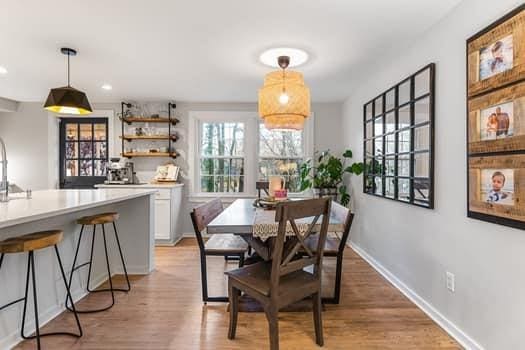 dining space with light wood-type flooring and sink