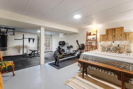 bedroom featuring concrete floors