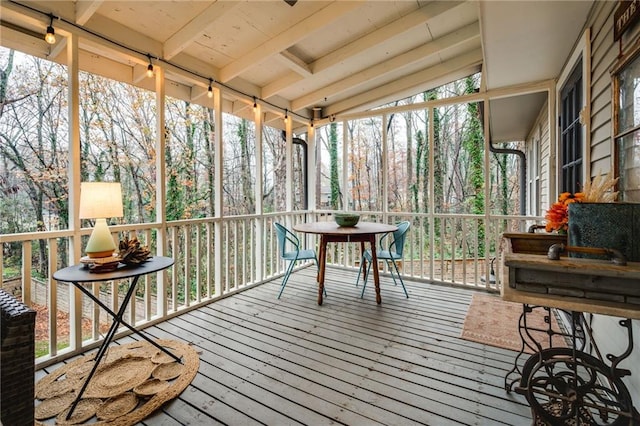 sunroom / solarium with beam ceiling