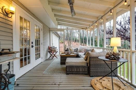 sunroom with vaulted ceiling with beams and french doors