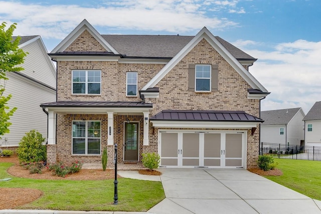 1459 Bennett Creek Ovlk, Suwanee, GA 30024 - craftsman house featuring brick siding, an attached garage, concrete driveway, and a standing seam roof