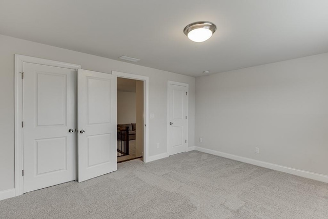 1459 Bennett Creek Ovlk, Suwanee, GA 30024 - unfurnished bedroom featuring baseboards and light carpet