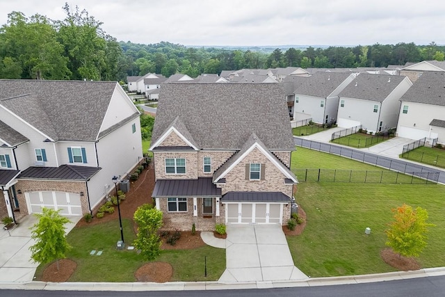 1459 Bennett Creek Ovlk, Suwanee, GA 30024 - view of front facade featuring concrete driveway, a garage, a standing seam roof, a residential view, and brick siding