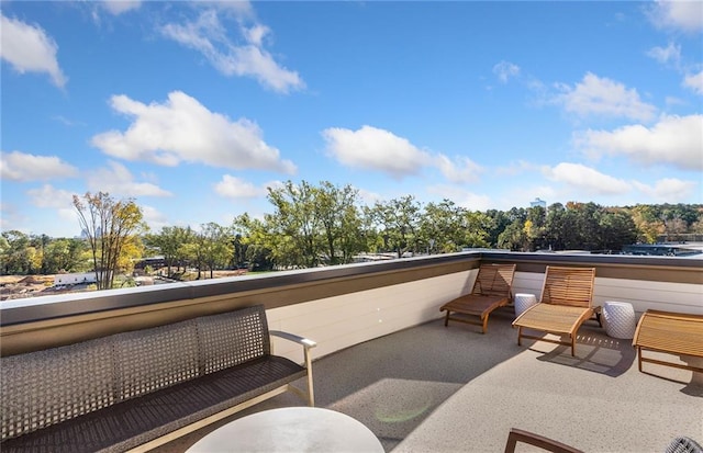 view of patio featuring a balcony