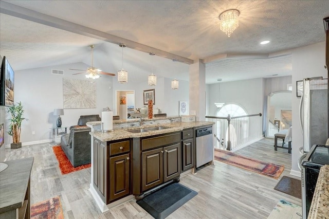 kitchen featuring visible vents, a sink, electric stove, a textured ceiling, and dishwasher