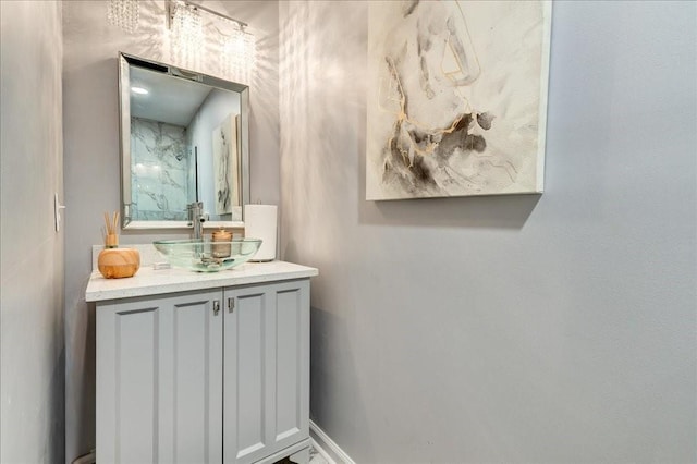 bathroom featuring baseboards and vanity