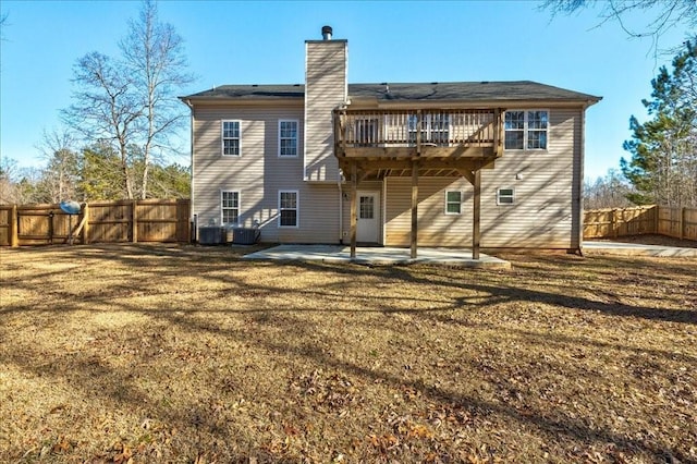 back of house with a patio, fence, a yard, central AC unit, and a chimney