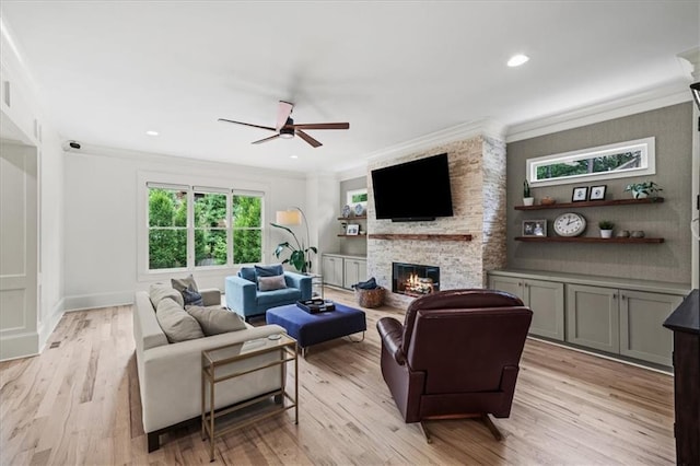 4048 Navajo Trl, Brookhaven, GA 30319 - living area featuring ornamental molding, ceiling fan, a fireplace, light wood finished floors, and recessed lighting