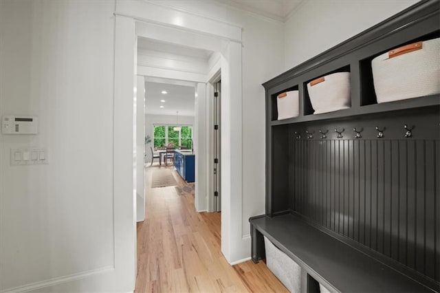 4048 Navajo Trl, Brookhaven, GA 30319 - mudroom with light wood finished floors, ornamental molding, and baseboards