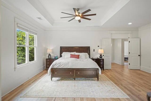 4048 Navajo Trl, Brookhaven, GA 30319 - bedroom featuring a tray ceiling, light wood finished floors, crown molding, baseboards, and recessed lighting