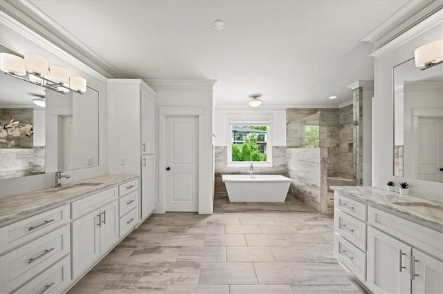 4048 Navajo Trl, Brookhaven, GA 30319 - full bathroom featuring crown molding, two vanities, a stall shower, a soaking tub, and recessed lighting