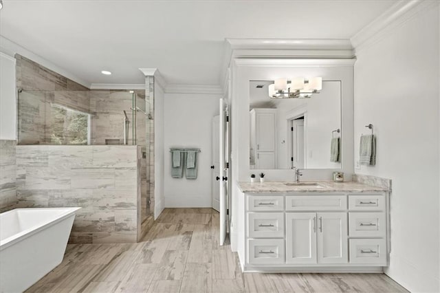 4048 Navajo Trl, Brookhaven, GA 30319 - bathroom with a freestanding bath, a stall shower, ornamental molding, vanity, and a chandelier