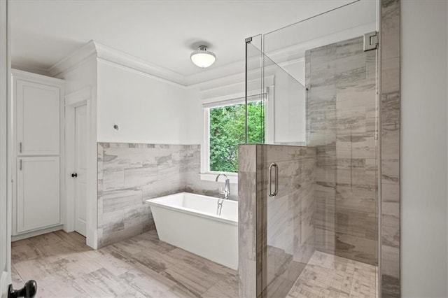 4048 Navajo Trl, Brookhaven, GA 30319 - full bath with tile walls, a freestanding bath, ornamental molding, a stall shower, and a wainscoted wall