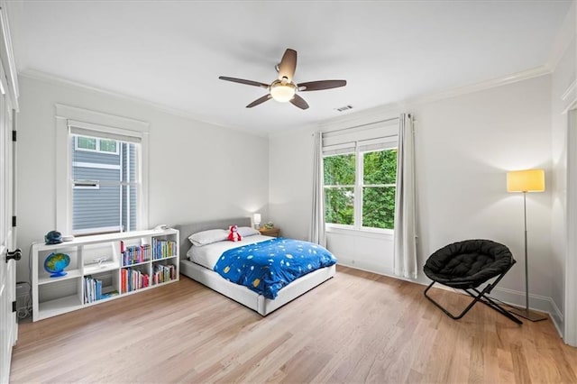 4048 Navajo Trl, Brookhaven, GA 30319 - bedroom featuring multiple windows, crown molding, light wood finished floors, ceiling fan, and baseboards
