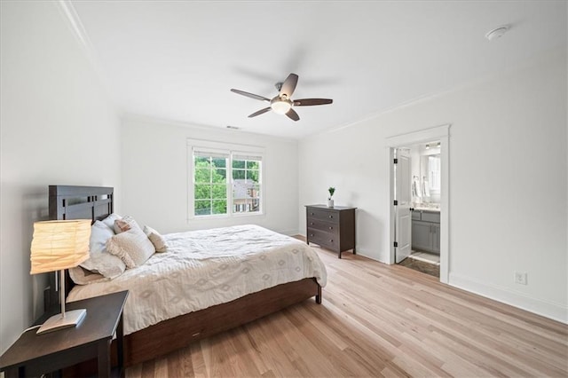 4048 Navajo Trl, Brookhaven, GA 30319 - bedroom featuring crown molding, light wood-style flooring, baseboards, a ceiling fan, and ensuite bath