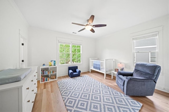 4048 Navajo Trl, Brookhaven, GA 30319 - bedroom featuring wood finished floors, crown molding, ceiling fan, and baseboards