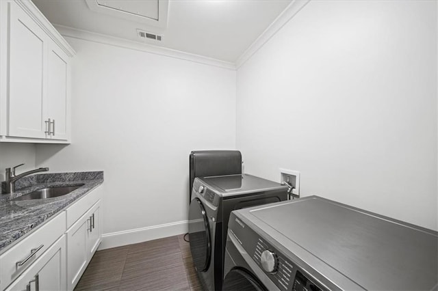 4048 Navajo Trl, Brookhaven, GA 30319 - washroom with washing machine and clothes dryer, cabinet space, ornamental molding, and baseboards