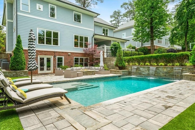 4048 Navajo Trl, Brookhaven, GA 30319 - outdoor pool with an outdoor hangout area, french doors, and a patio area