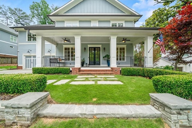 4048 Navajo Trl, Brookhaven, GA 30319 - greek revival inspired property featuring a ceiling fan, a front yard, a porch, and board and batten siding