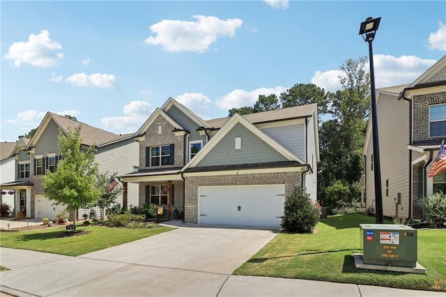 craftsman inspired home with a garage, concrete driveway, brick siding, and a front lawn