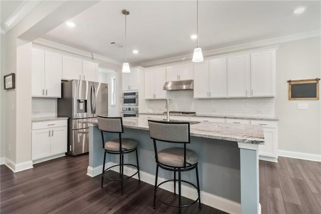 kitchen featuring under cabinet range hood, white cabinetry, appliances with stainless steel finishes, and dark wood-type flooring