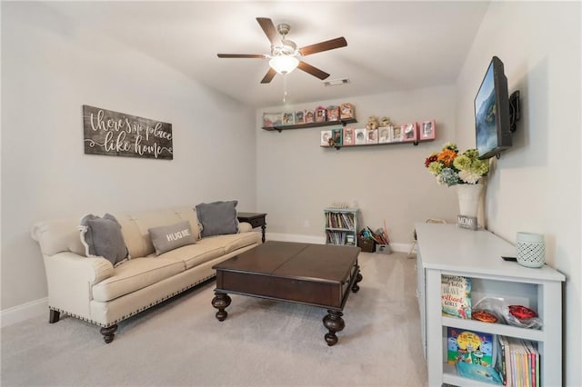 carpeted living area featuring visible vents, ceiling fan, and baseboards