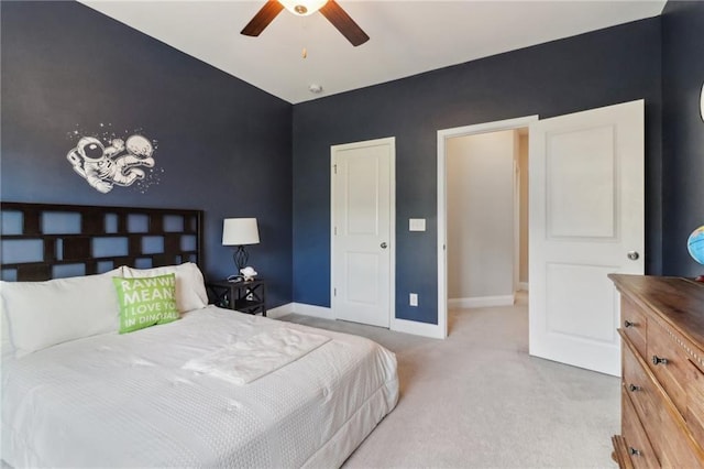 bedroom with carpet, ceiling fan, and baseboards