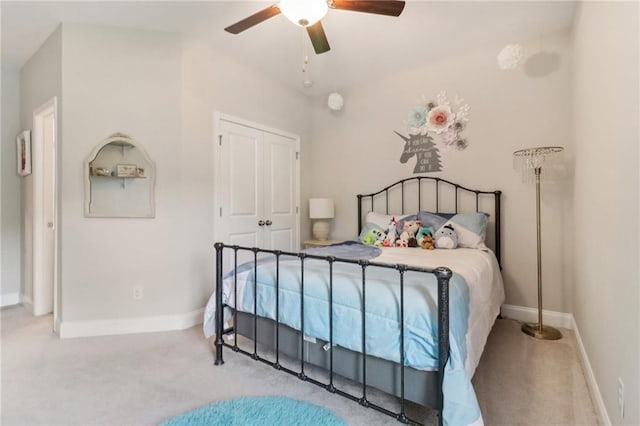 bedroom with carpet flooring, a ceiling fan, and baseboards