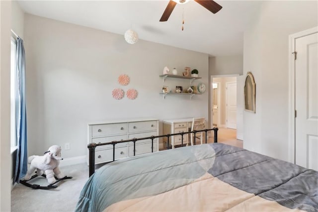 carpeted bedroom featuring ceiling fan and baseboards