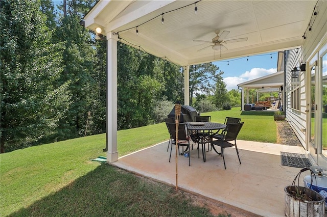 view of patio with a ceiling fan and outdoor dining space