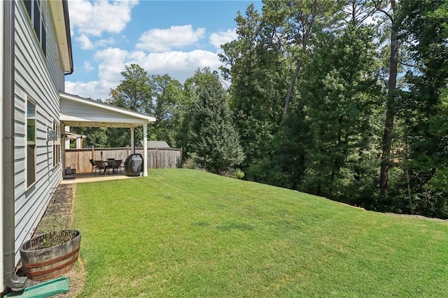 view of yard featuring a patio area and fence