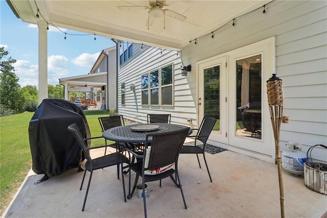 view of patio featuring outdoor dining area and a ceiling fan