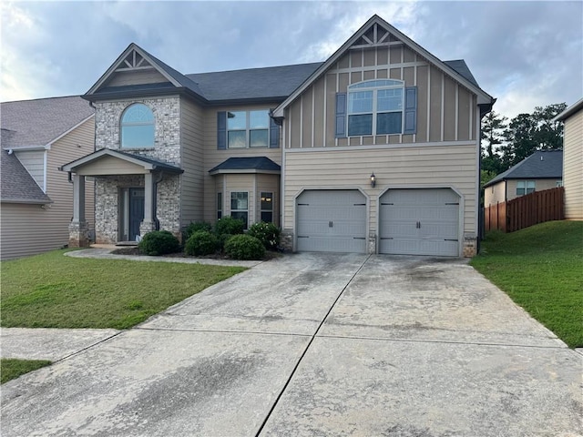 3897 Valley Bluff Ln, Snellville, GA 30039 - view of front of property with board and batten siding, stone siding, concrete driveway, and a garage
