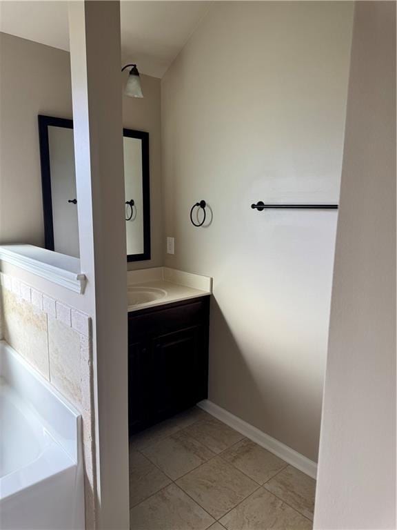 3897 Valley Bluff Ln, Snellville, GA 30039 - bathroom featuring a bath and vanity
