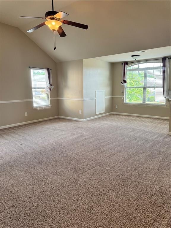 3897 Valley Bluff Ln, Snellville, GA 30039 - carpeted empty room with baseboards, ceiling fan, plenty of natural light, and vaulted ceiling