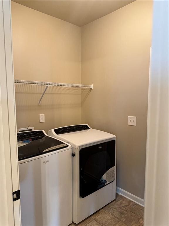 3897 Valley Bluff Ln, Snellville, GA 30039 - laundry room featuring independent washer and dryer and baseboards