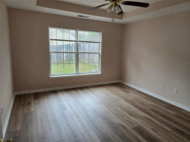 bathroom with vanity, hardwood / wood-style floors, toilet, and walk in shower