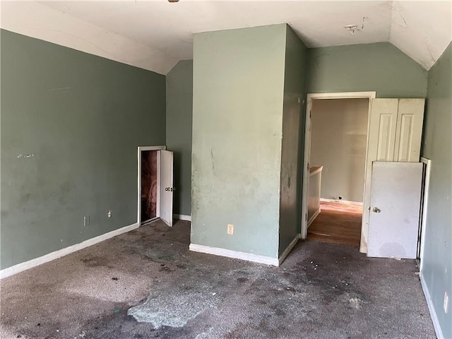 empty room with vaulted ceiling