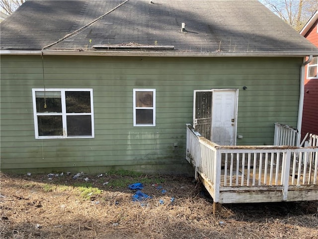 back of house featuring a wooden deck