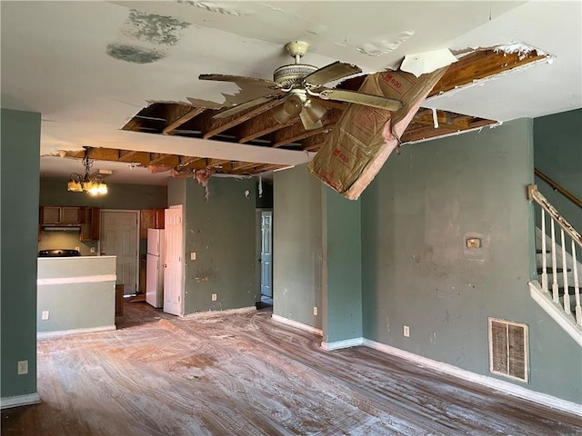 unfurnished living room featuring ceiling fan